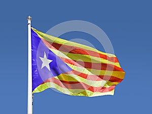 Catalan estelada flag with blue sky photo