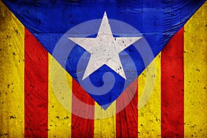 Catalan flag Against the background of a concrete wall
