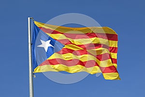 Catalan flag independence separatist flag waving in blue sky