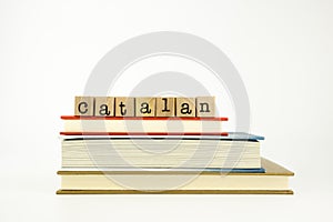 Catalan language word on wood stamps and books photo