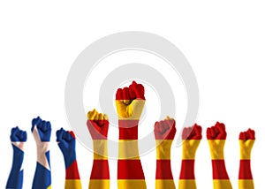 Catalan separatism concept with Senyera estelada Eastern Catalan lone star flag on people`s hand fists isolated on white