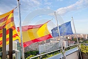 Catalan, Spanish, EU flags under Barcelona