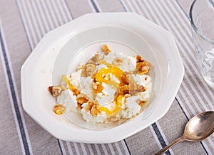 Catalan whey cheese, mato, served on plate with honey and walnuts photo