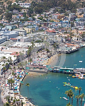Catalina Island vacation resort, Avalon, California, aerial view of green pleasure pier, calm ocean bay view of colorful houses, b
