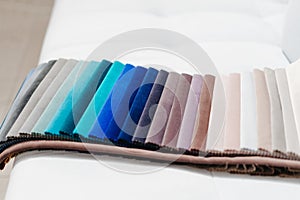 Catalog of multi-colored fabric samples. Textile industry background.