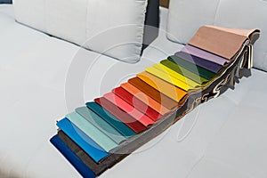 Catalog of multi-colored fabric samples. Textile industry background.