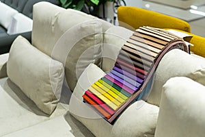 Catalog of multi-colored fabric samples. Textile industry background.