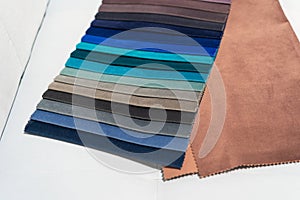 Catalog of multi-colored fabric samples. Textile industry background.