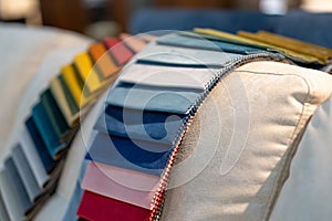 Catalog of multi-colored fabric samples. Textile industry background.