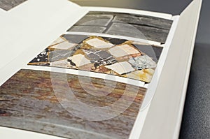 Catalog of samples of kitchen worktops made of chipboard. Close-up photo