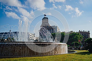 Catalonia square also know as Plaza Catalunya, the square of the city of Barcelona, is seen on a summer day with fountains and