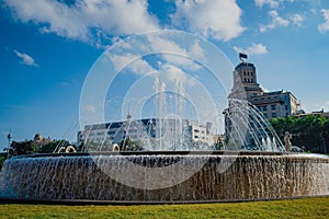 Catalonia square also know as Plaza Catalunya, the square of the city of Barcelona, is seen on a summer day with fountains and