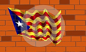 The Catalunya flag on wall of bricks photo