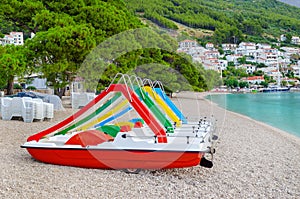 Catamaran on the beach in Brela, Croatia and beautiful seascape