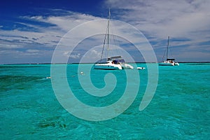 Catamaran on clear turquoise water