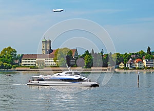 Catamaran ferry at Lake Constance in front of palace Friedrichshafen