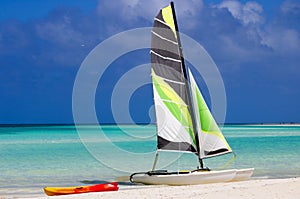 Catamaran and kayak on the beach in the Caribbeans