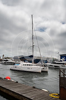 Catamaran motoring into harbour