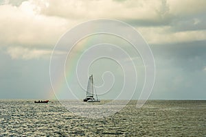 Catamaran at Rodney bay with rainbow in the backround, Saint Lucia, Caribbean sea