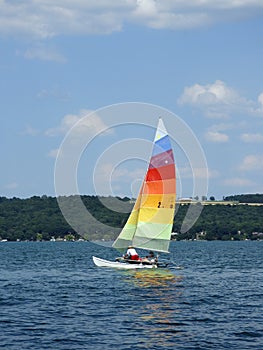 Catamaran sailboat on sunny summer day in FingerLakes photo