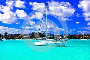 Catamaran sailing boat in turquoise waters of Mauritius island