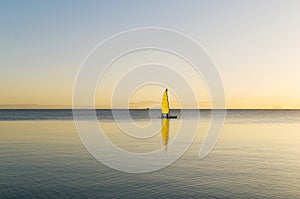 Catamaran sailing at Sunset