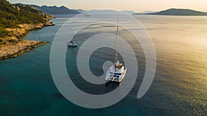 Catamaran at sunset in the Aegean sea