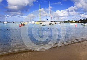 Catamarans and boats in a bay. Grand Bay (Grand Baie). Mauritius