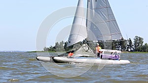 Catamarans go in the regatta by sea 009