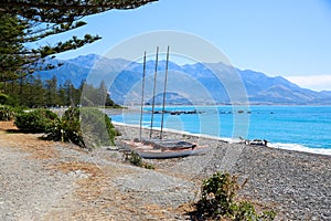 Catamarans on Kaikoura pebble Beach, New Zealand