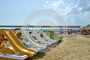 Catamarans with a slide on the beach. Summer vacation