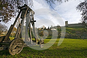 Catapult under city wall photo