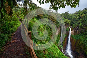 Catarata del Toro waterfall with footpath in Costa Rica photo