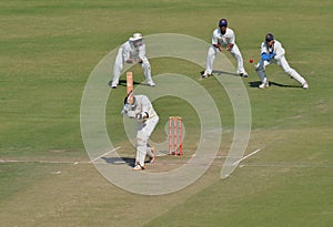 Catch Attempt by Wicket Keeper During a Cricket Match