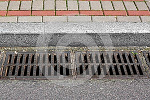 Catch basin grate of the lattice of the drain system for drainage of rainwater. photo