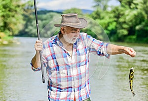 Catch me if you can. mature man fishing. summer weekend. fisherman with fishing rod. trout bait. retired bearded fisher