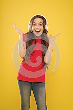 Catch the rhythm. Little girl enjoying her favorite music. Kid listening music headphones. Music beat concept