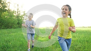 catch-up. children kid dream together run in the park at sunset. happy family people in park concept. boy and girl