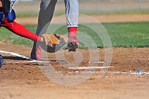 Catcher reaching for a runner