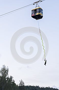 Catching adrenaline - bungee jumping of cable car over river Gauja in Latvia