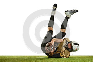 Catching ball and falling. Man, professional american football player in motion, training over white studio background