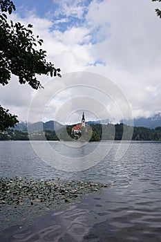 Catching a glimpse of the church of the mother of god on the island of Lake Bled