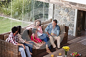 Catching up with the family. A three generation family relaxing together at home.