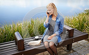 Catching up with friends during my lunch break. an attractive woman talking on the phone during her lunchbreak in the