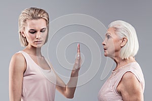 Categorical blonde woman shutting her mother up