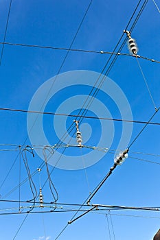 catenary of train under blue sky