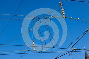 catenary under blue sky for electrified trains