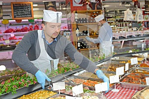 Caterer arranging trays food photo