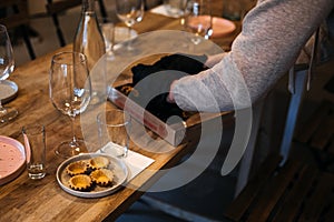 Caterer arranging gourmet tartlets for event photo