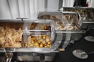 Catering buffet food with heated trays ready for service